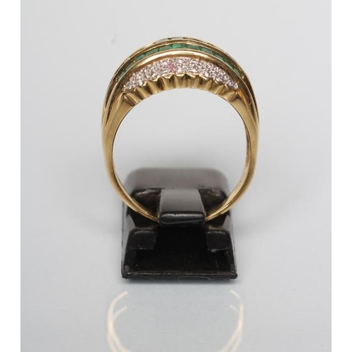 169 - AN EMERALD AND DIAMOND COCKTAIL RING, the three rows of channel set square cut emeralds within rows ... 