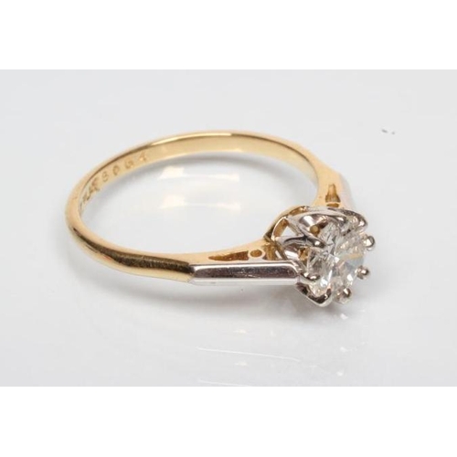 170 - A SOLITAIRE DIAMOND RING, the round brilliant cut stone of approximately 0.70cts claw set to a plain... 