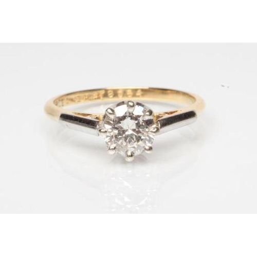 170 - A SOLITAIRE DIAMOND RING, the round brilliant cut stone of approximately 0.70cts claw set to a plain... 