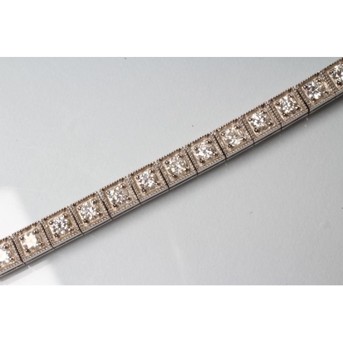 177 - A MOISSANITE TENNIS BRACELET, the thirty six round brilliant cut stones point set in square panels t... 