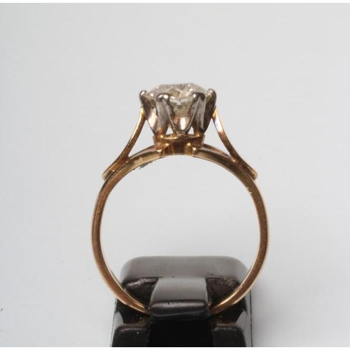 182 - A SOLITAIRE DIAMOND RING, the round brilliant cut stones of approximately 1.80cts claw set to petal ... 