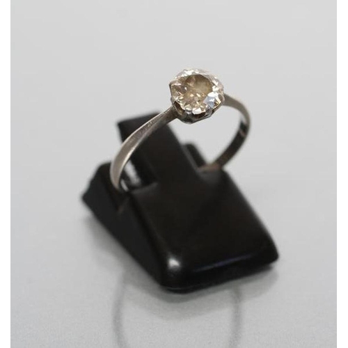 183 - A SOLITAIRE DIAMOND RING, the old brilliant cut stone of approximately 0.6cts, claw set to an unmark... 