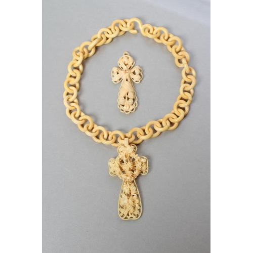 185 - A VICTORIAN IVORY CROSS PENDANT of open form, carved with lily of the valley and other flowers, 3 3/... 