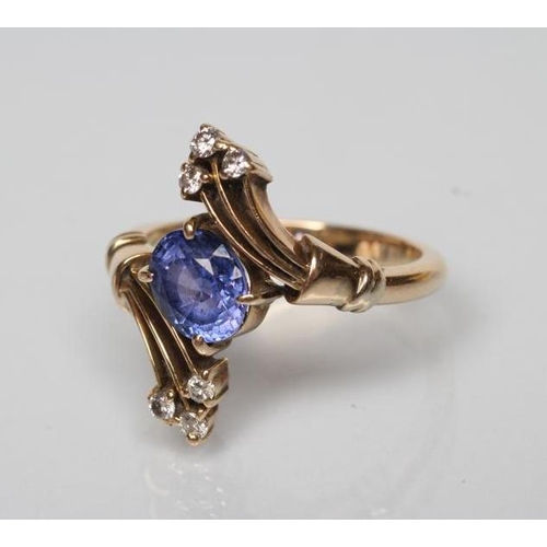 187 - A SAPPHIRE AND DIAMOND COCKTAIL RING, the oval facet cut sapphire diagonally claw set to triple edge... 