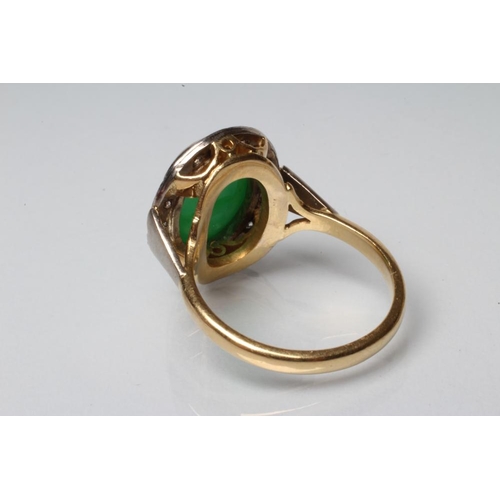 190 - AN EMERALD AND DIAMOND DRESS RING, the oval cabochon polished emerald open back collet set to a bord... 