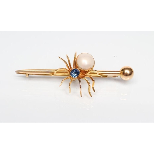 195 - AN EDWARDIAN SPIDER BROOCH with oval facet cut sapphire head and blister pearl body on arrow head ba... 