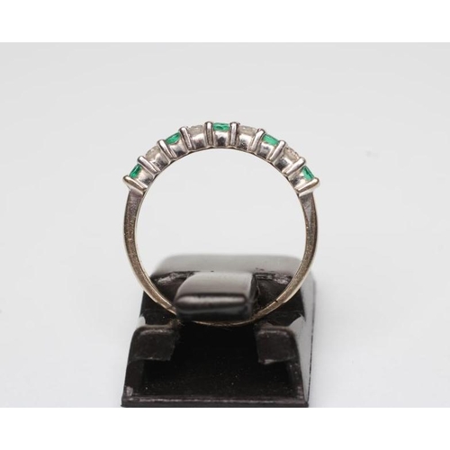 197 - AN EMERALD AND DIAMOND HALF HOOP ETERNITY RING, the five emeralds and four diamonds point set to a p... 