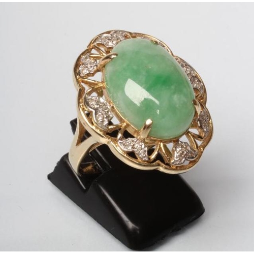 198 - A COCKTAIL RING, the oval cabochon polished jadeite panel claw set to an open floriform border set w... 