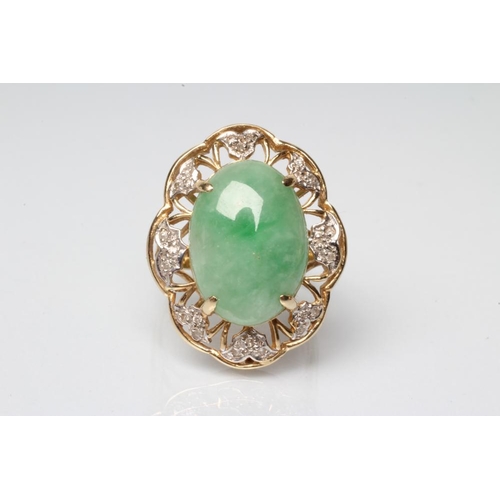 198 - A COCKTAIL RING, the oval cabochon polished jadeite panel claw set to an open floriform border set w... 