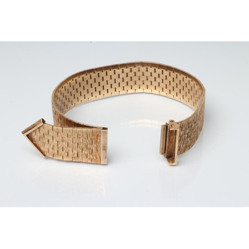 208 - A 9CT GOLD STRAP BRACELET, sponsor's mark RCK, London 1968, with brushed bark finish and faux buckle... 