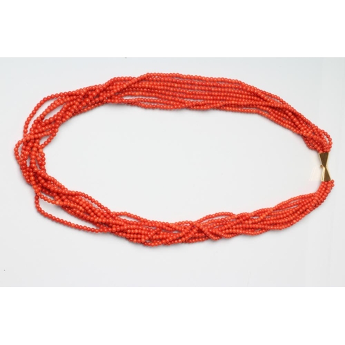 215 - AN EIGHT STRAND CORAL BEAD NECKLACE on unmarked gold bow clasp, 32