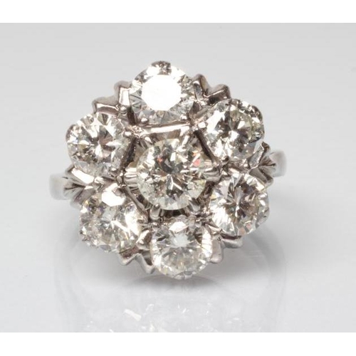 218 - A DIAMOND CLUSTER RING, the seven round brilliant cut stones totalling approximately 3.50cts, claw s... 