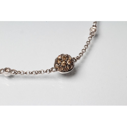 230 - A DIAMOND BRACELET, the four bosses each set with numerous brown stones with white diamond spacers a... 