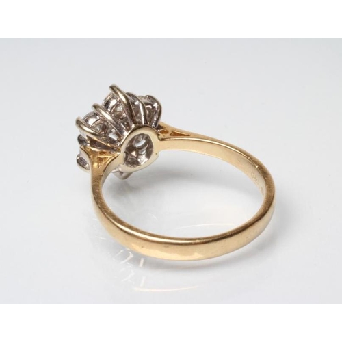 243 - A DIAMOND CLUSTER RING, the seven round brilliants claw set to a plain 18ct gold shank, Sheffield, s... 