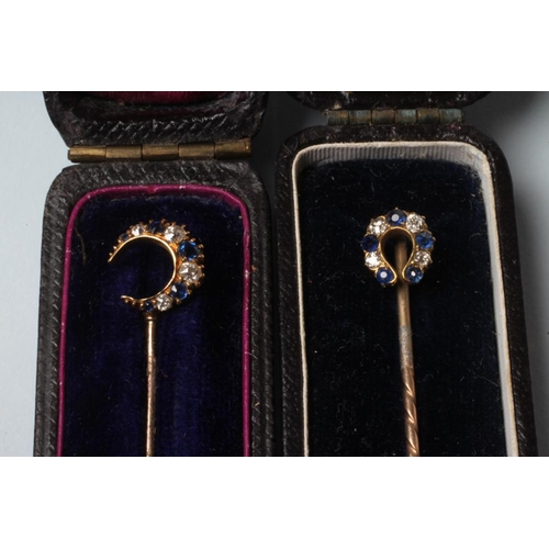 246 - TWO VICTORIAN DIAMOND AND SAPPHIRE STICK PINS, one surmounted with a crescent moon, the other a hors... 