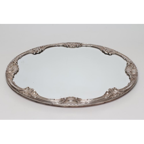 87 - A MIRRORED PLATEAU, maker Camusso, STERLING 925 Peru, of plain oval form, the scroll bevelled mirror... 