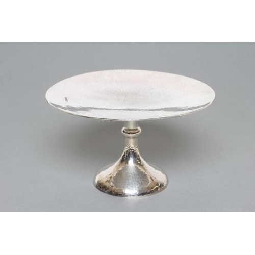 99 - A PLANISHED TAZZA, maker's mark H.A., Sheffield 1914, the slightly dished circular top on a single k... 