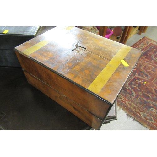 32 - WALNUT BRASS BANDED WRITING SLOPE AND AN EBONY WRITING SLOPE