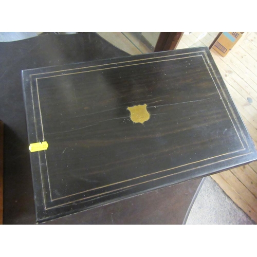 32 - WALNUT BRASS BANDED WRITING SLOPE AND AN EBONY WRITING SLOPE