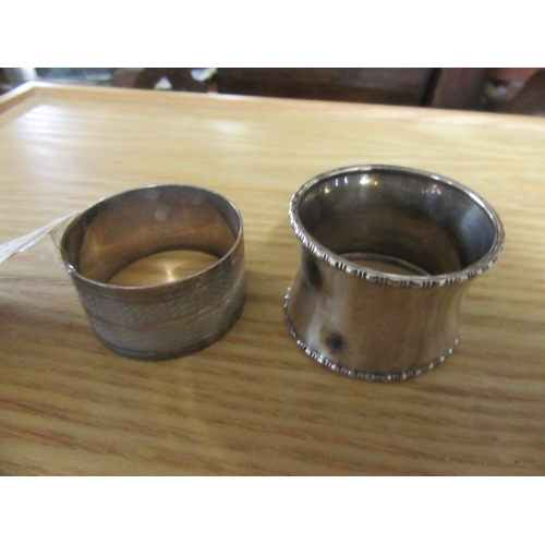 222 - TWO SILVER NAPKIN RINGS AND A PEPPERETTE   1OZ 19DWT    PLUS GLASS PEPPERETTE