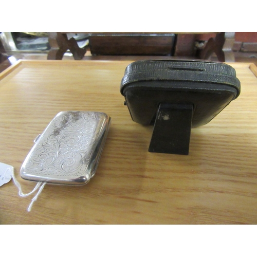 228 - SILVER CIGARETTE CASE 1OZ 19DWT AND A SILVER MOUNTED WATCH CASE