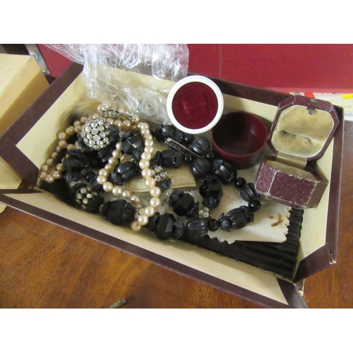 291 - SMALL BOX OF COSTUME JEWELLERY