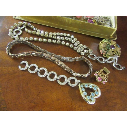 292 - SMALL BOX OF COSTUME JEWELLERY