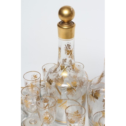 51 - A FRENCH GLASS LIQUEUR SET, 19th century, comprising pair of mallet decanters with globular stoppers... 