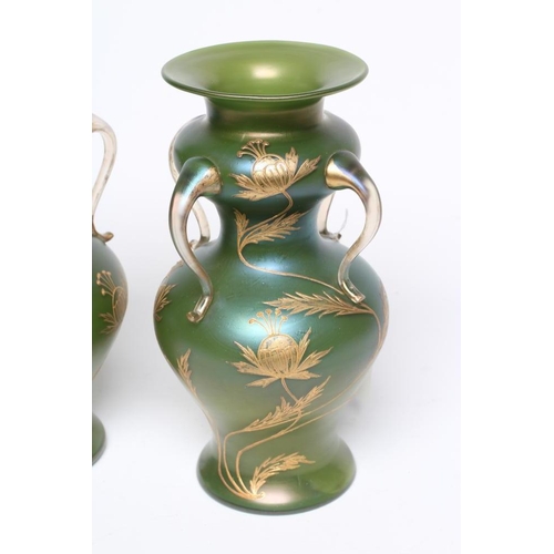 59 - A PAIR OF ART NOUVEAU GLASS VASES of double inverted baluster form with four drawn and applied clear... 