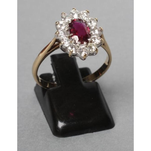 254 - A RUBY AND DIAMOND CLUSTER RING, the oval facet cut ruby claw set to a border of twelve round brilli... 