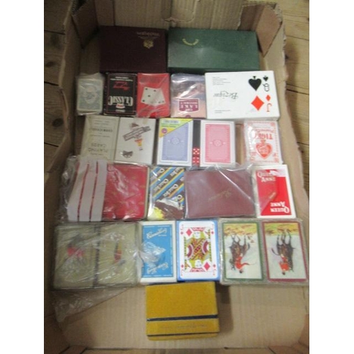 112 - FOUR BOXES OF GAMES INCLUDING PLAYING CARDS ETC