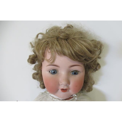 105 - An Armand Marseille bisque socket head character doll, with blue glass sleeping eyes, open mouth, ap... 