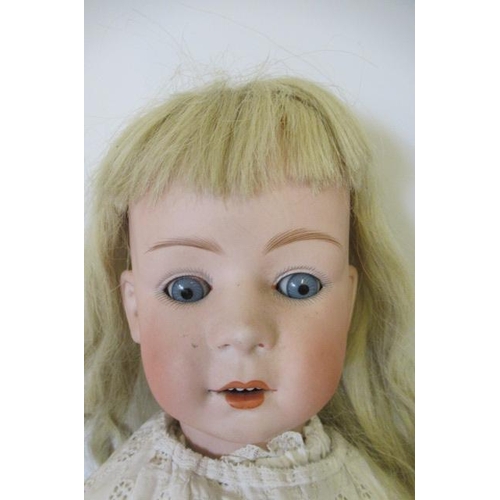 107 - A Mirette bisque socket head doll, with blue glass sleeping eyes, open mouth, teeth, blonde wig, woo... 