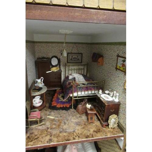 116 - A large Georgian style doll's house and contents, of wooden construction with nine internal rooms, w... 