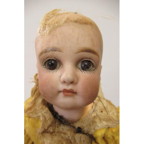 12 - Two French bisque socket head dolls, one 9 1/2