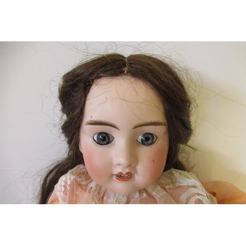 13 - An A. Lanternier & Cie bisque socket head doll, with fixed blue paperweight eyes, open mouth, six to... 