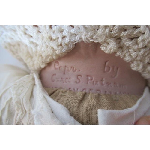 133 - A bisque head flange neck baby doll, by Grace S Putnam, with brown sleeping eyes, closed mouth, moul... 