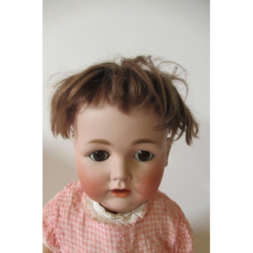 138 - A J D Kestner bisque socket head character doll, with brown glass sleeping eyes, open mouth, applied... 