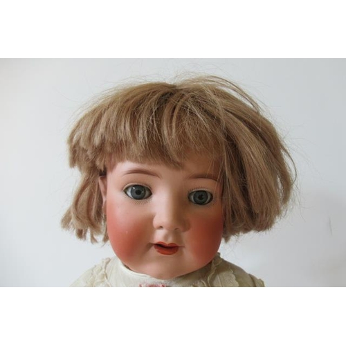 140 - A Heubach Koppelsdorf bisque socket head doll, with brown glass sleeping eyes, open mouth, applied t... 