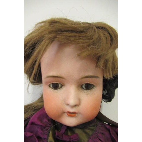 18 - A Bruno Schmidt bisque socket head doll, with brown glass sleeping eyes, open mouth, applied teeth, ... 