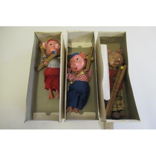 207 - Three Pelham puppets comprising Pinky and Perky Pigs and Rupert the Bear, boxes P, figures F-P (Est.... 