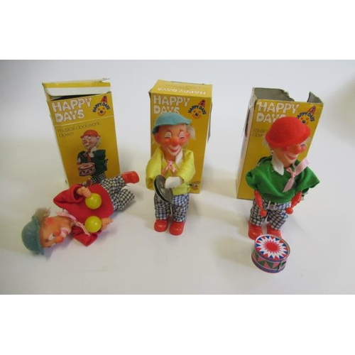 218 - Three Eisenmann clockwork clowns in plastic and tin boxes, AF, G (Est. plus 21% premium inc. VAT)