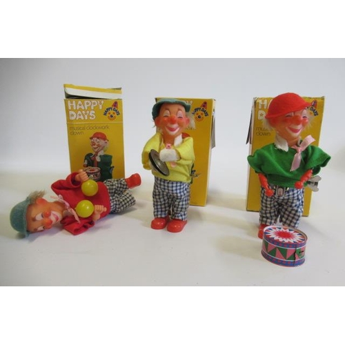 218 - Three Eisenmann clockwork clowns in plastic and tin boxes, AF, G (Est. plus 21% premium inc. VAT)