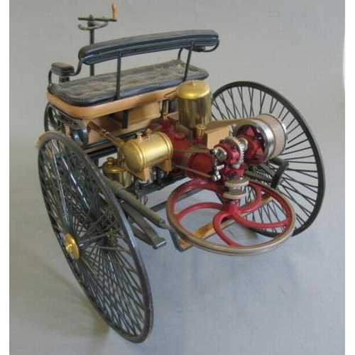 221 - A 1:8 scale model of the Mercedes tricycle car, plastic and metal construction, fuel tank loose, F-G... 