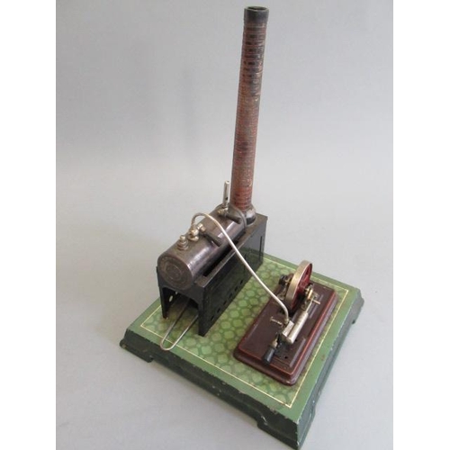 244 - Bing spirit fired stationary steam engine with black plated boiler, brick chimney, printed tile base... 