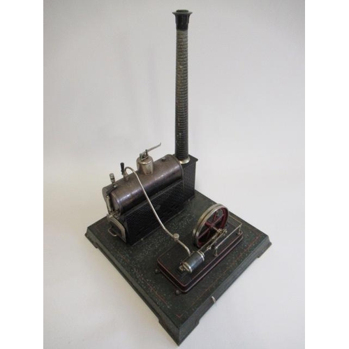 245 - A large Carette single cylinder stationary steam engine, plated black boiler with brick base and chi... 