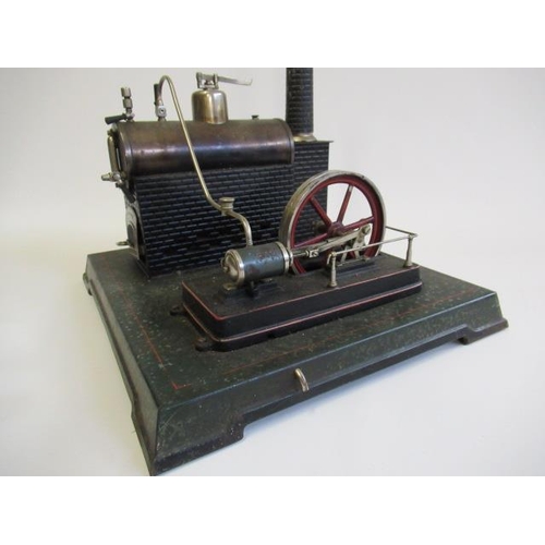 245 - A large Carette single cylinder stationary steam engine, plated black boiler with brick base and chi... 