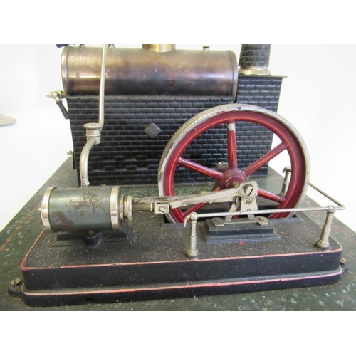 245 - A large Carette single cylinder stationary steam engine, plated black boiler with brick base and chi... 