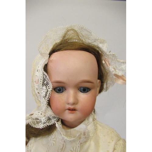 36 - Two German bisque socket head dolls, comprising a 10