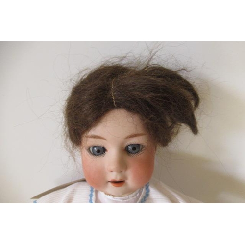 49 - A Gebruder Heubach bisque socket head lady doll, with blue glass sleeping eyes, open mouth and teeth... 